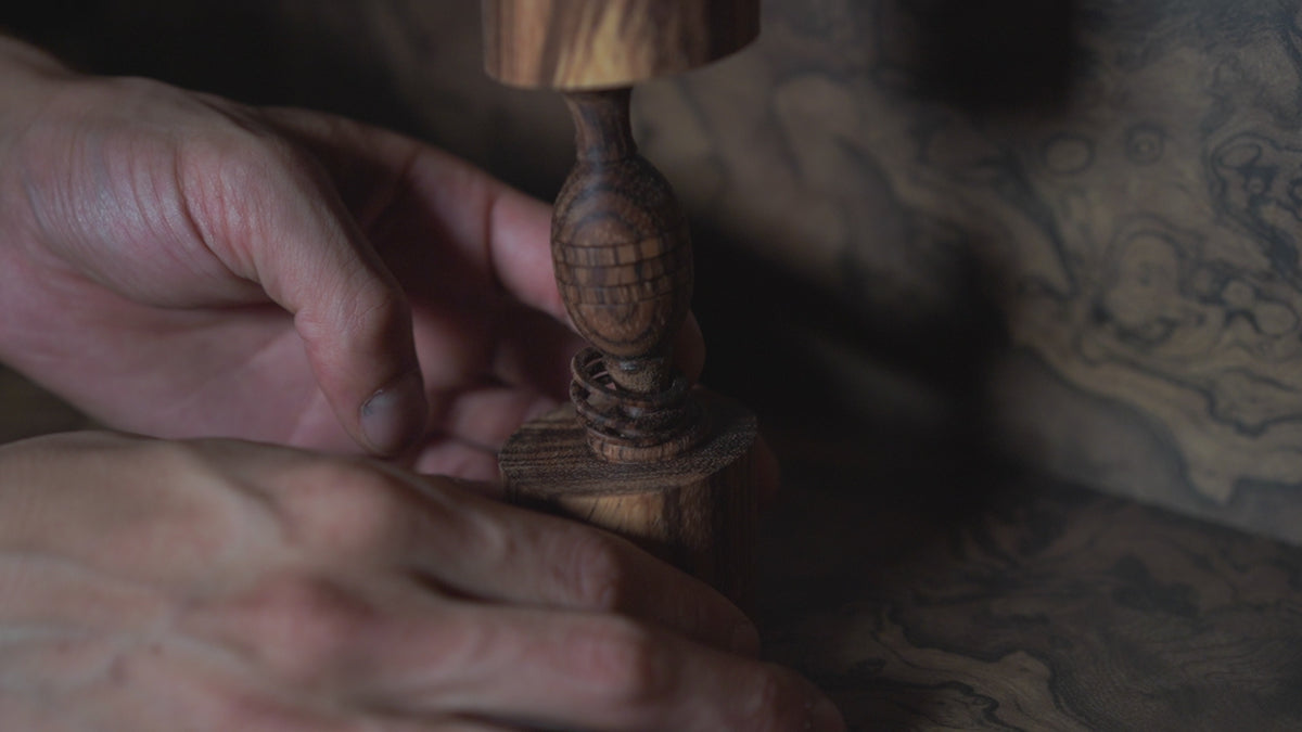 Off-Axis Ugetsubiki Ornament — the captive ring slid along the stem and spun