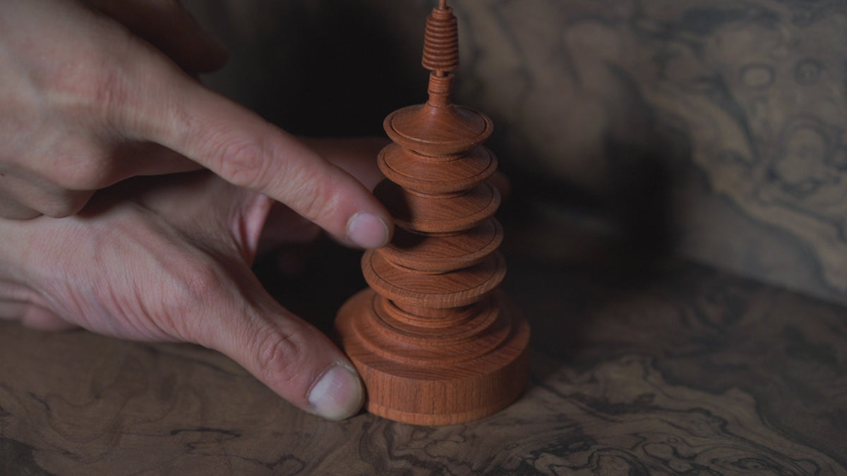 Five-Tiered Pagoda — the captive rings on the spire turned by a fingertip