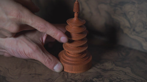 Five-Tiered Pagoda — the captive rings on the spire turned by a fingertip